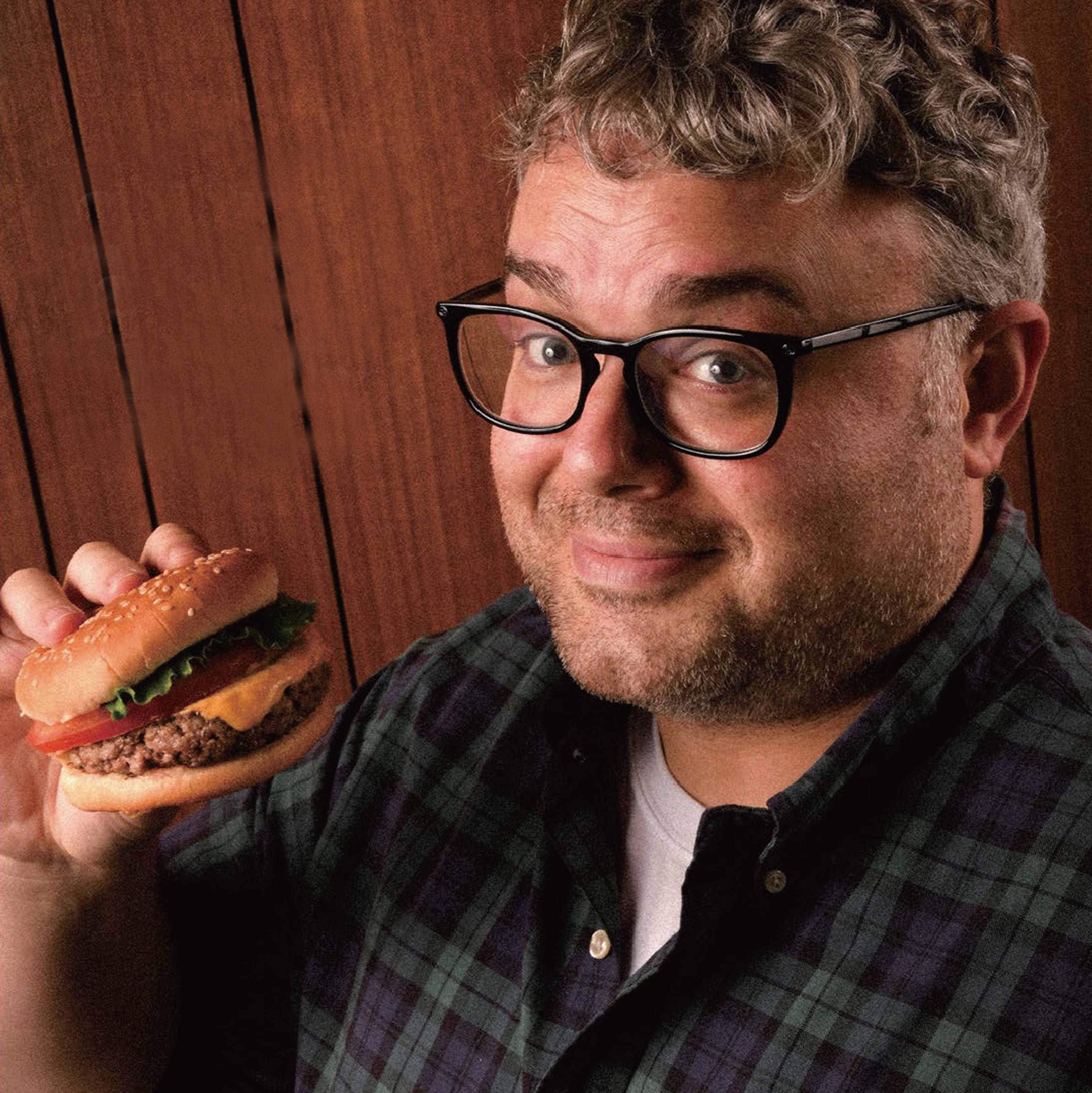 A guest holding an Onestar burger