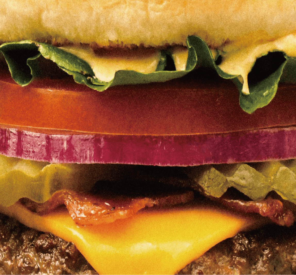 Layers of fresh vegetables, cheese and beef in an Onestar burger